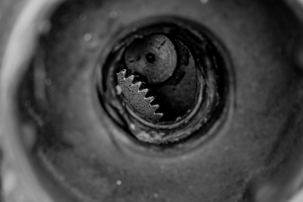 a black and white photo of a metal object