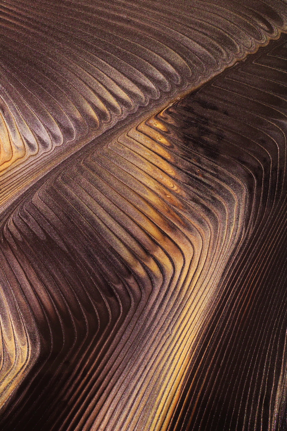 a close up of a sand dune with a sky background