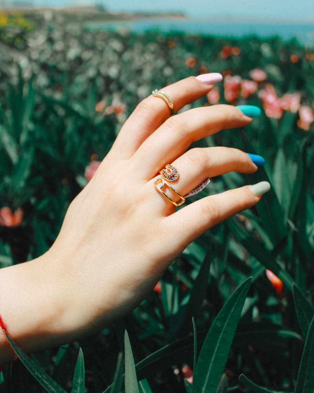 a woman's hand with two rings on it