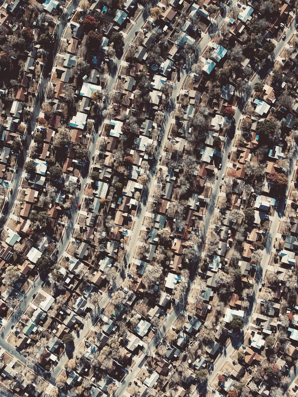 a bird's eye view of a city with lots of houses