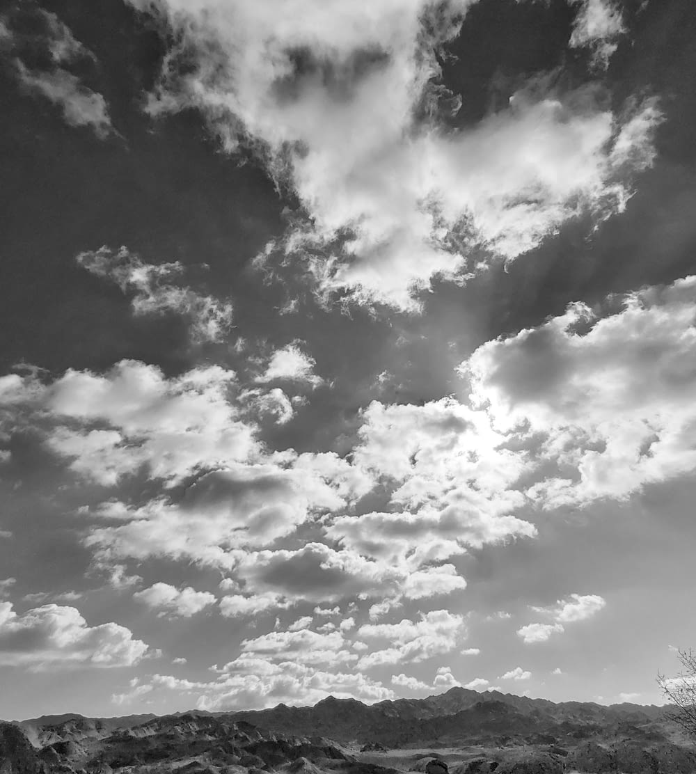 a black and white photo of clouds in the sky