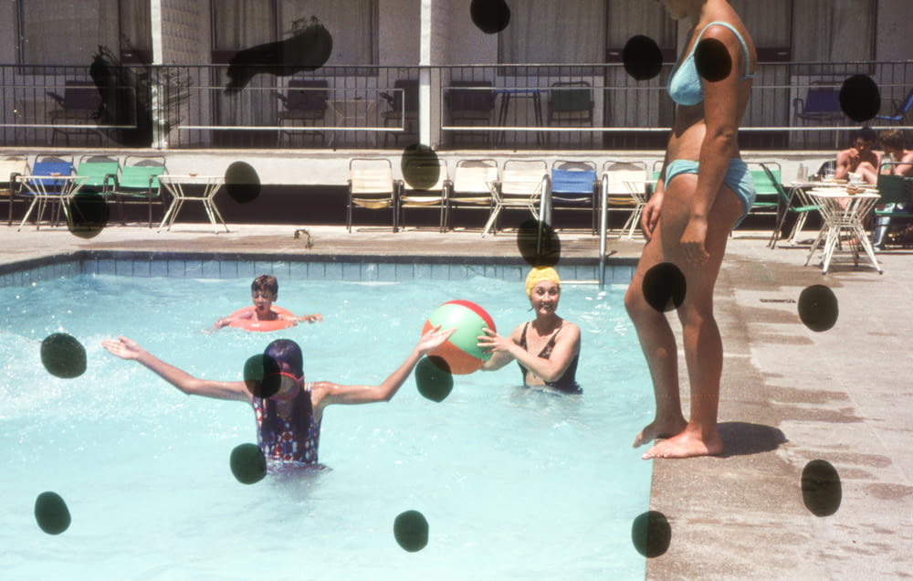 a group of people playing in a swimming pool