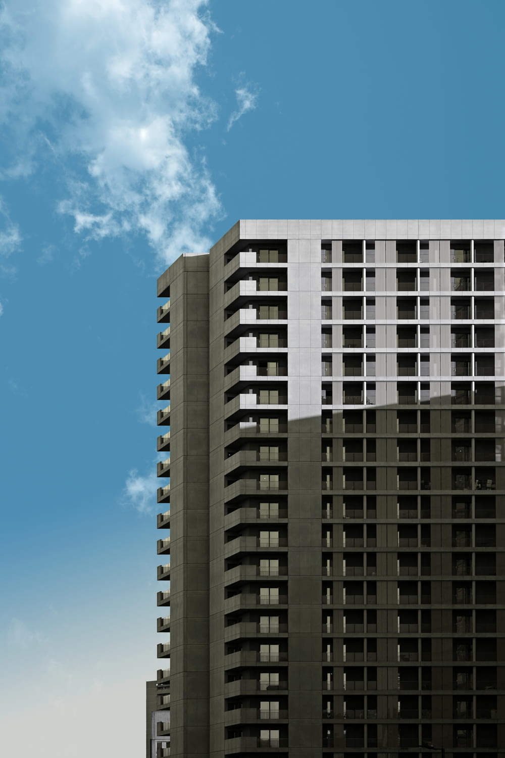 a tall building with a sky background