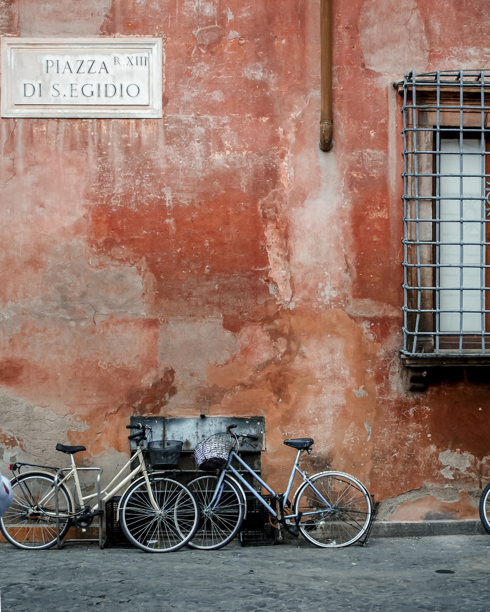bicycles parked in front of a brick building