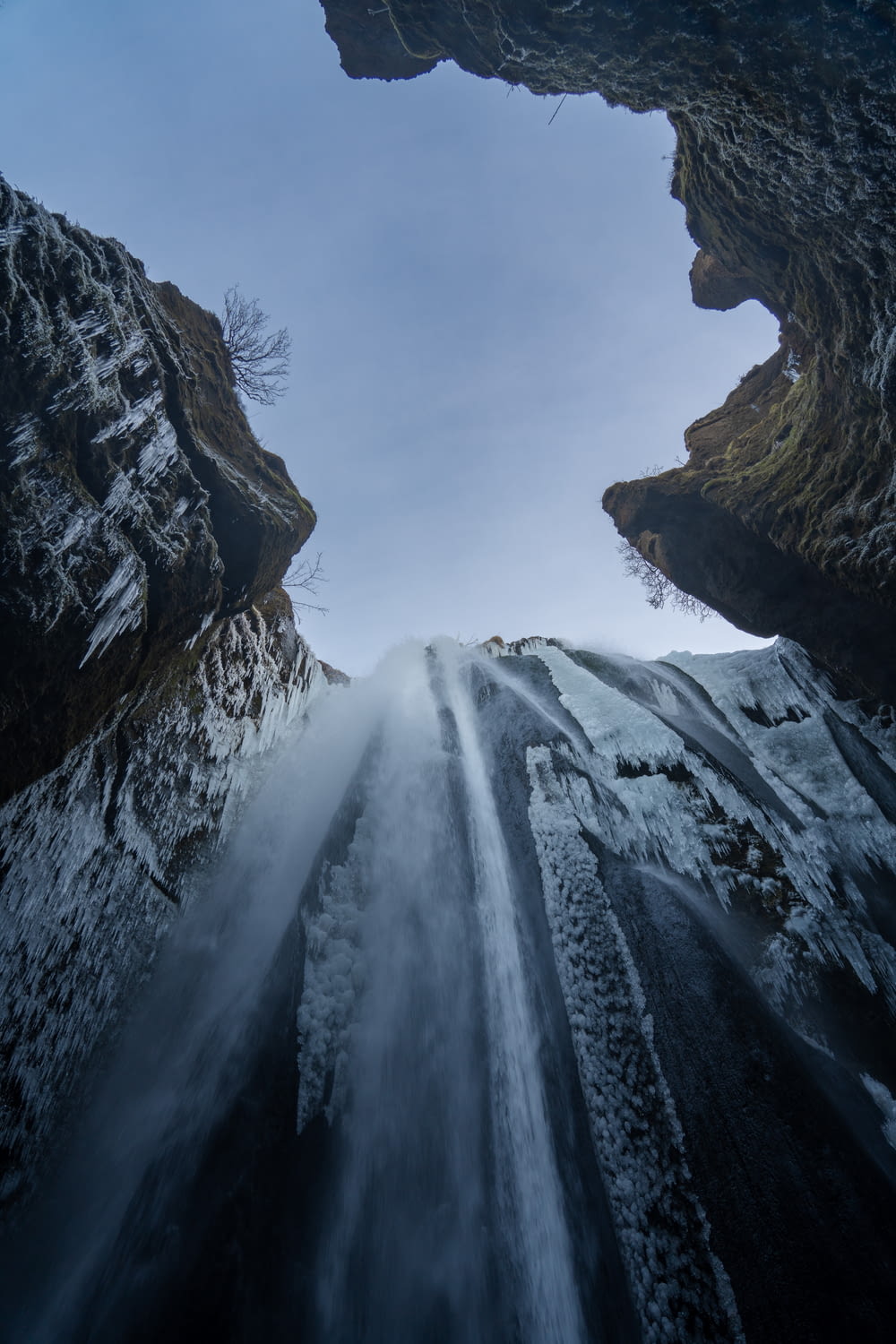 a waterfall between large rocks