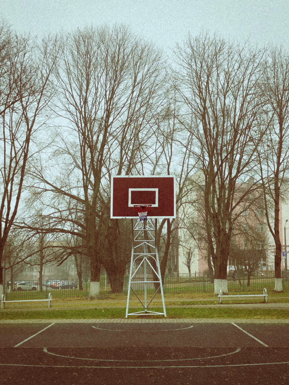 a basketball hoop in a park