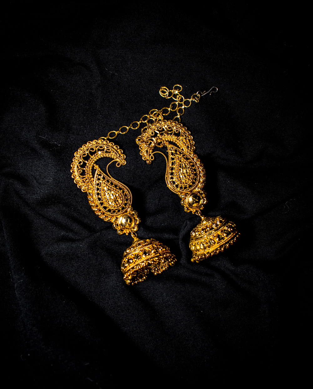 a gold and black necklace