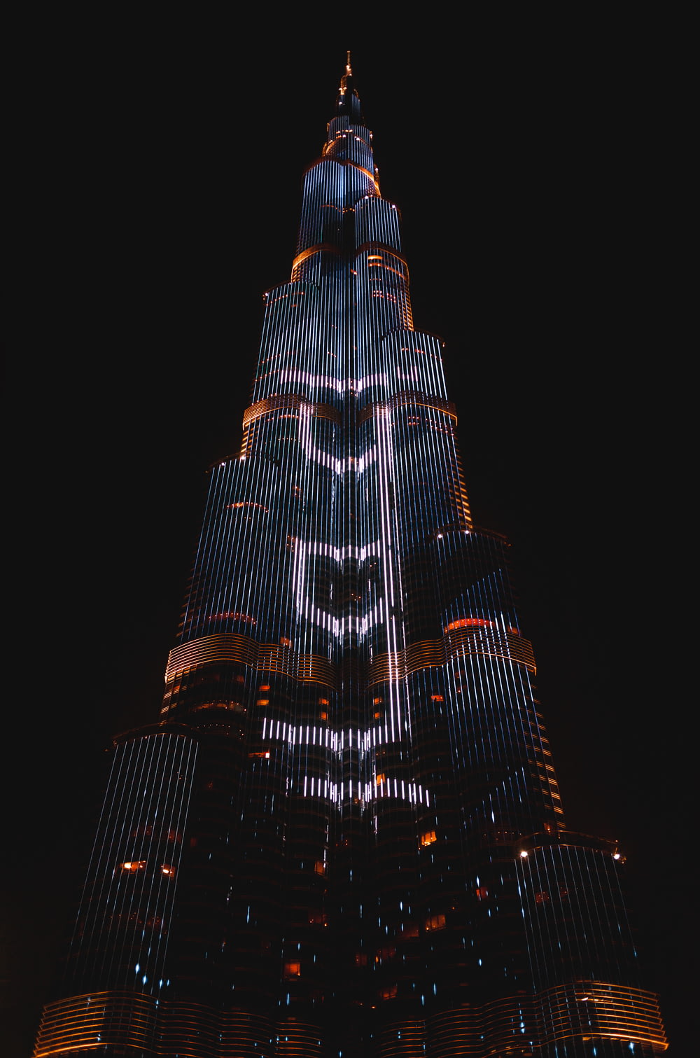 a tall building with lights at night
