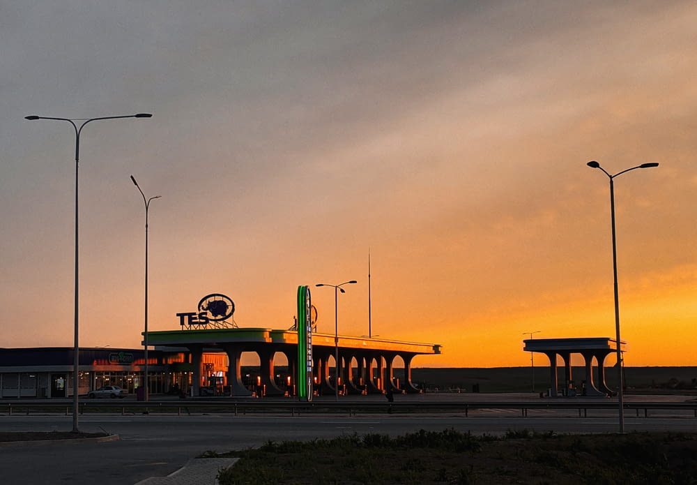 a gas station at sunset