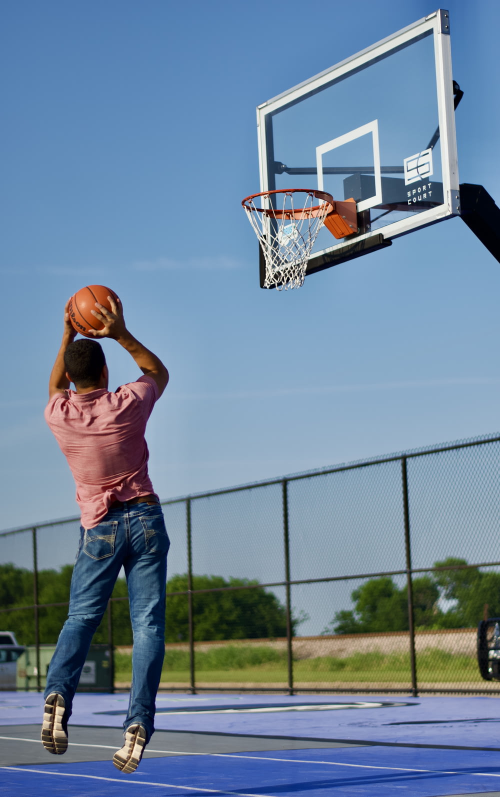 a man shooting a basketball