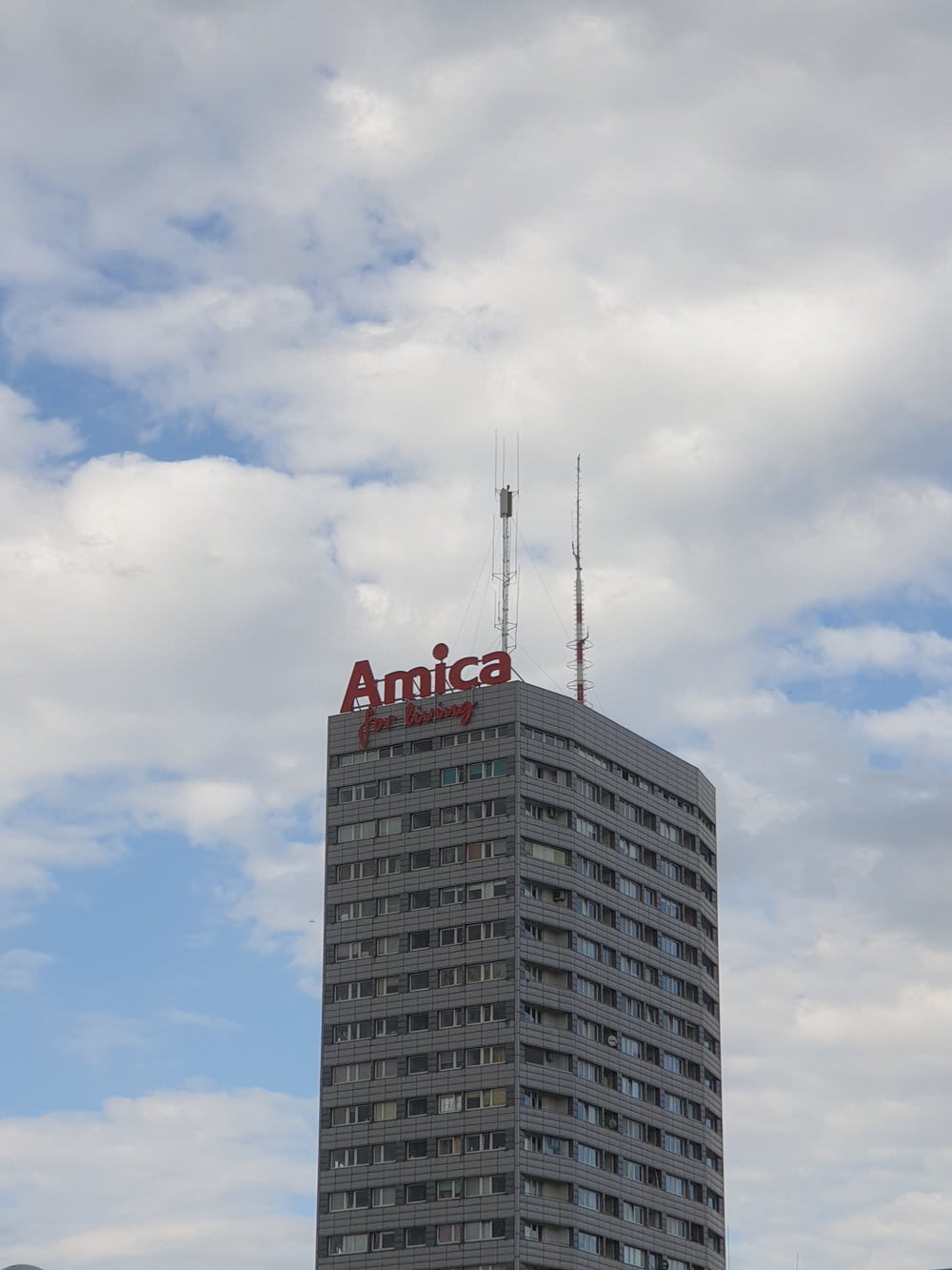 a tall building with a antenna on top