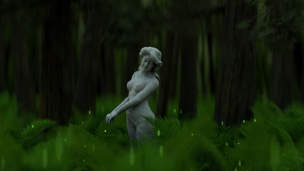 a statue in a forest