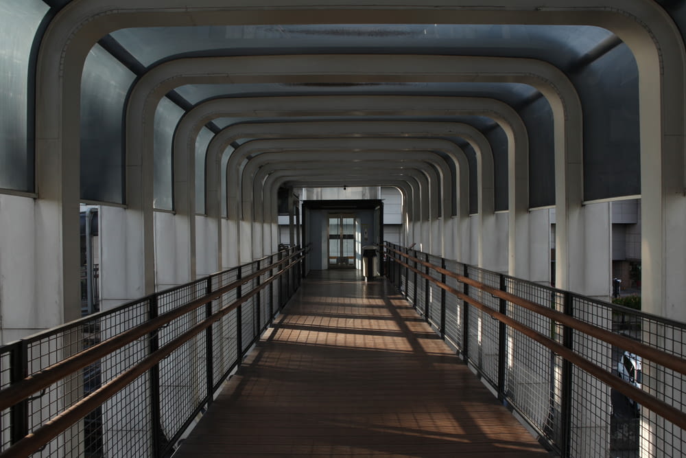 a long hallway with a railing