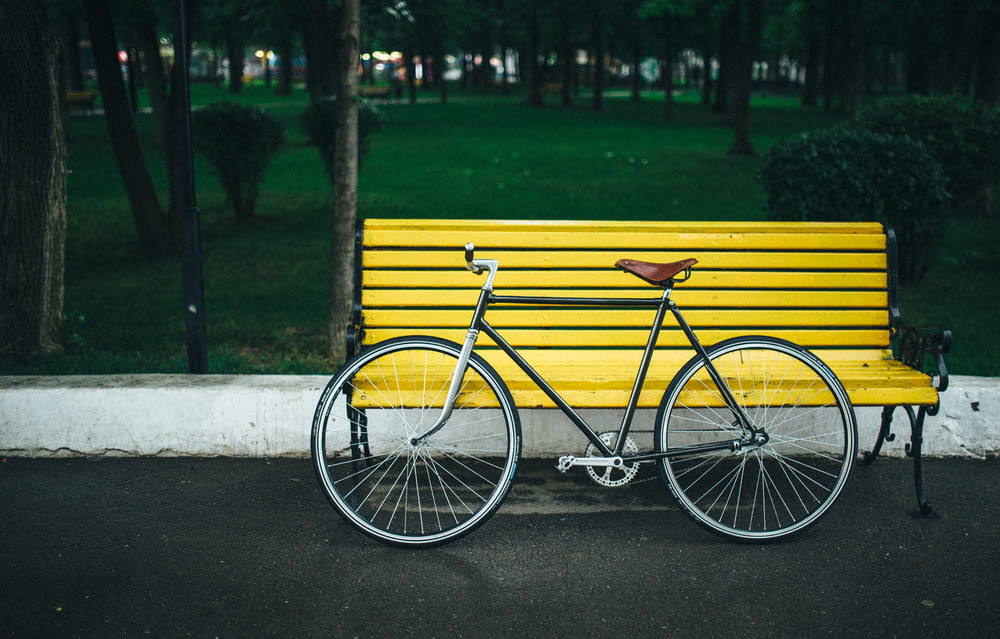 a bicycle is parked on a bench