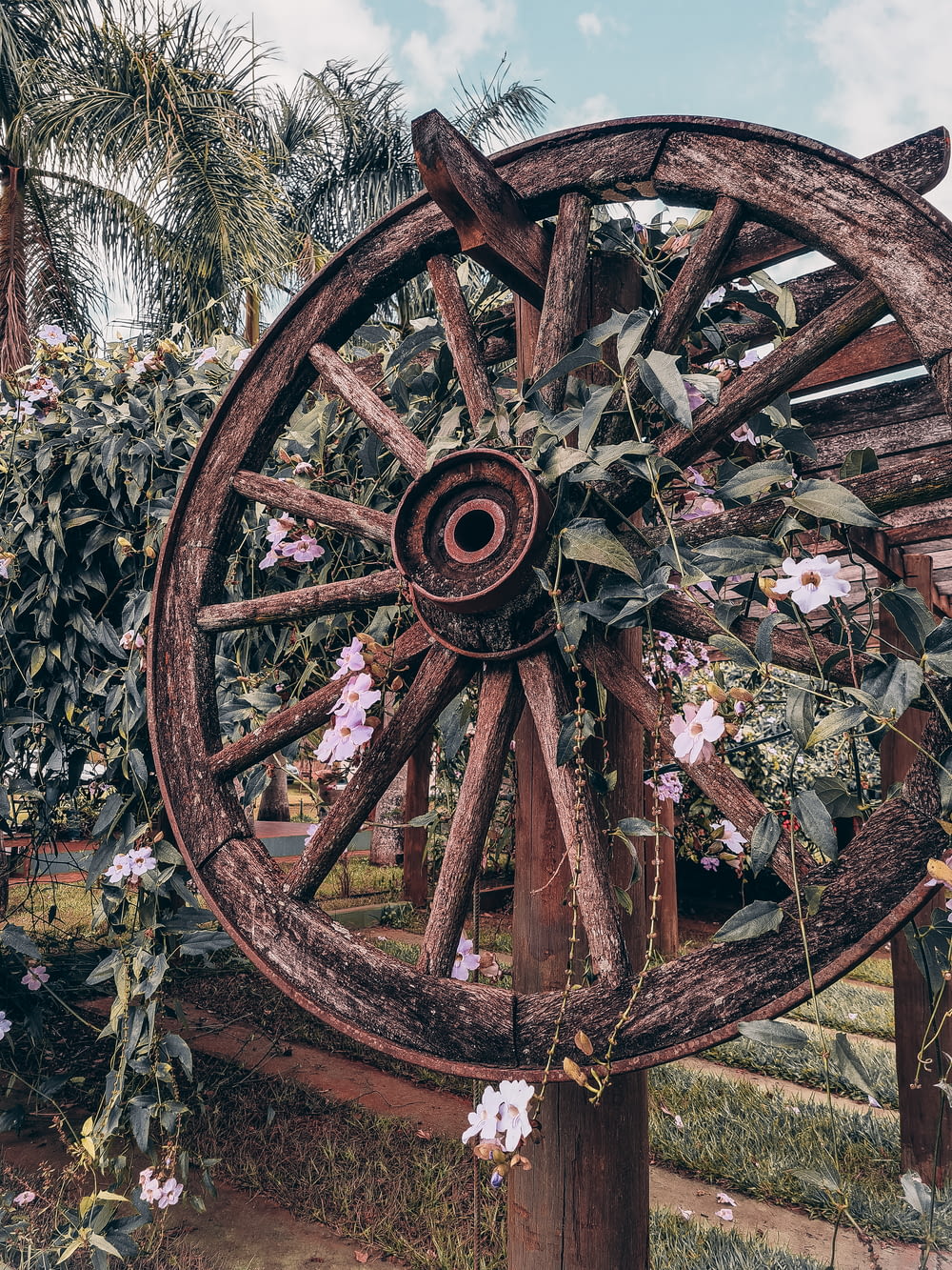 a wooden wheel with flowers