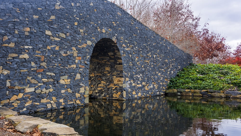 a stone bridge over a body of water