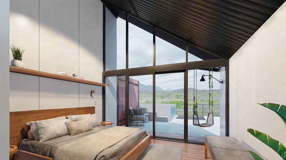 a bedroom with a bed and a sliding glass door