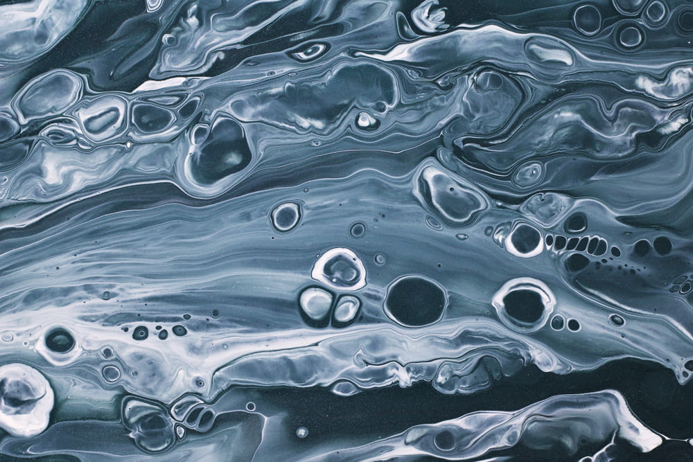 a black and white abstract painting with bubbles