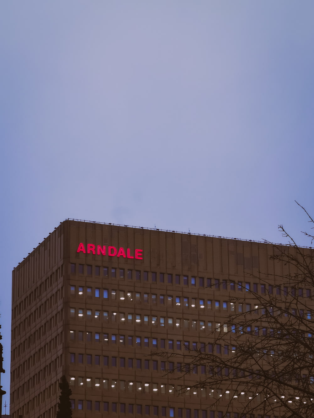 a tall building with a sign on the side of it