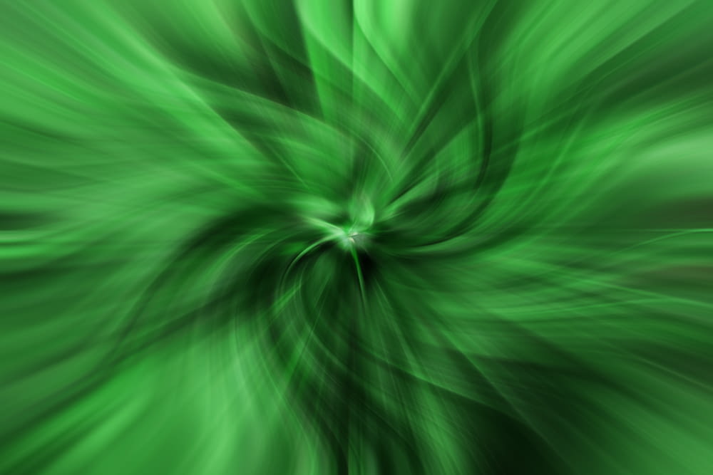 a green background with a large flower in the center