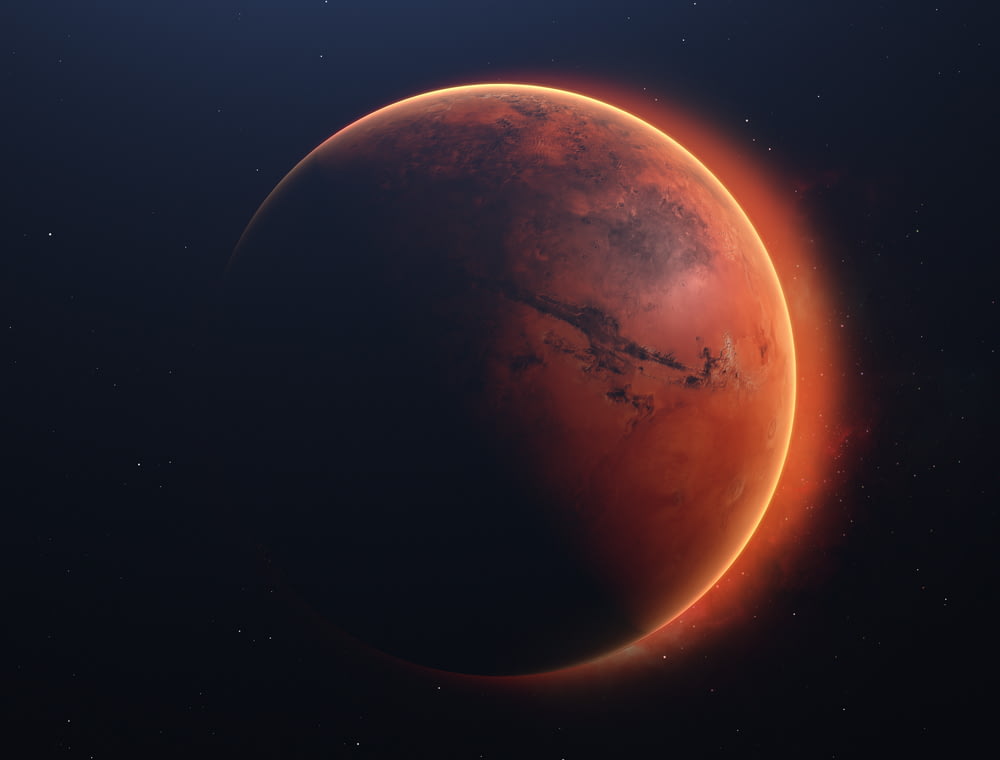 a red planet with a star in the background