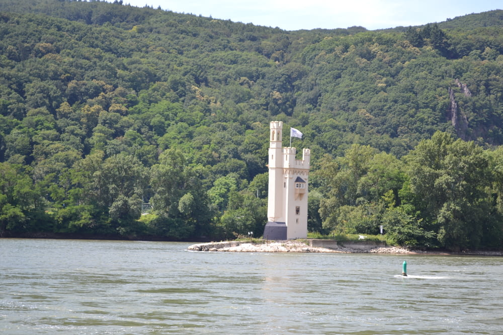 a tower on a small island in the middle of a lake