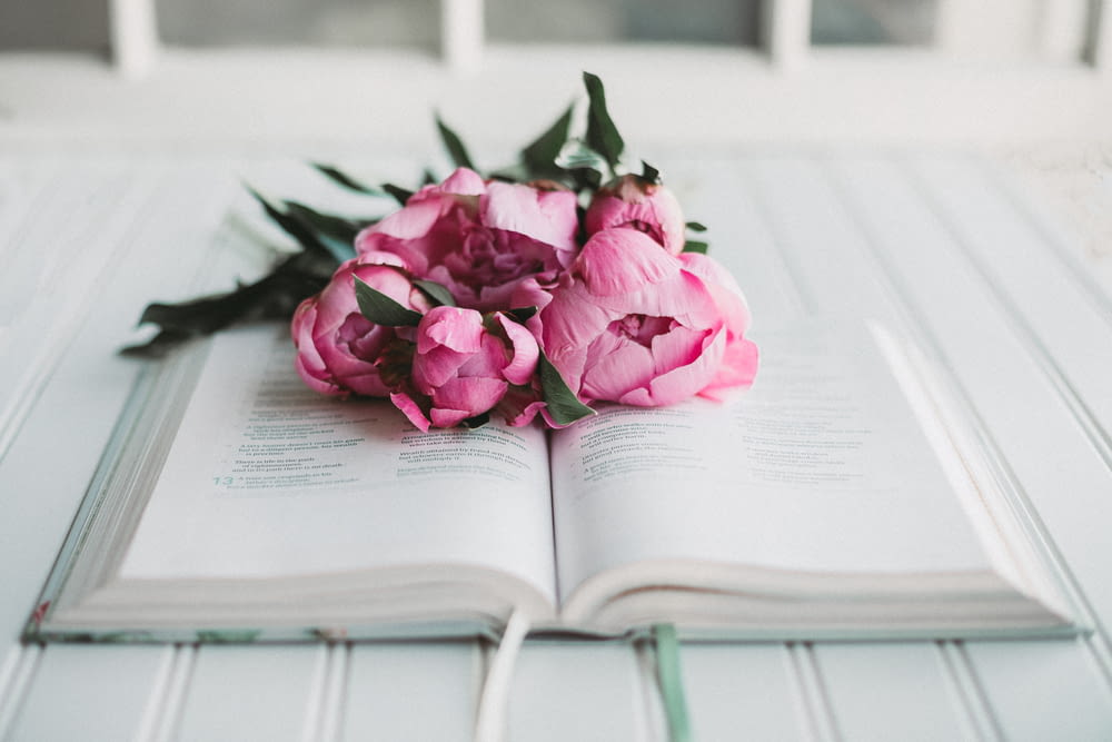 a bundle of flowers on a book