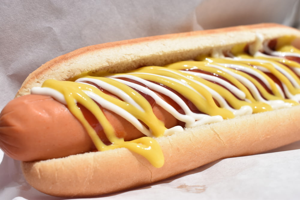 a hot dog with mustard and ketchup