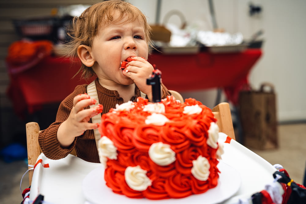 a girl eating a cake