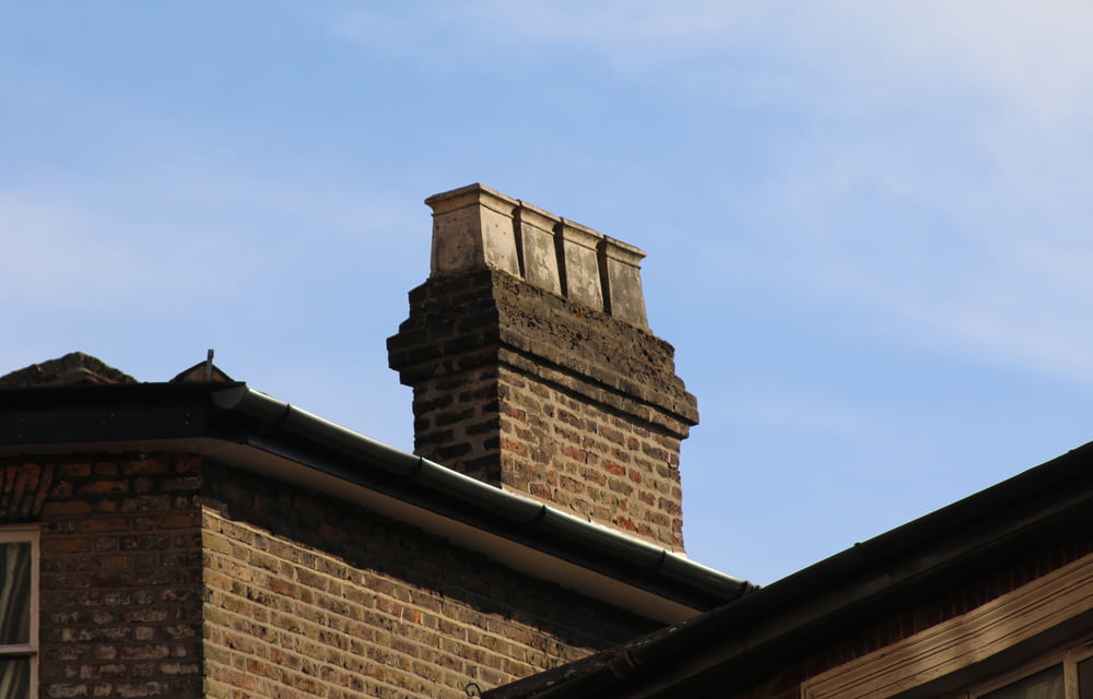 a brick building with a chimney