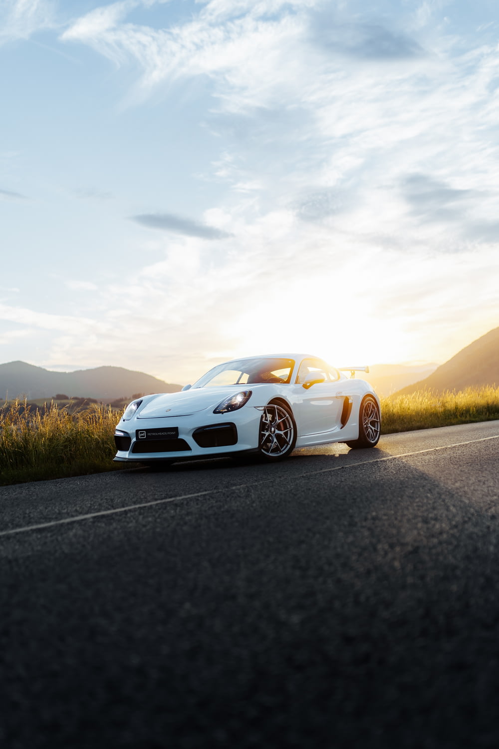 a white sports car on a road