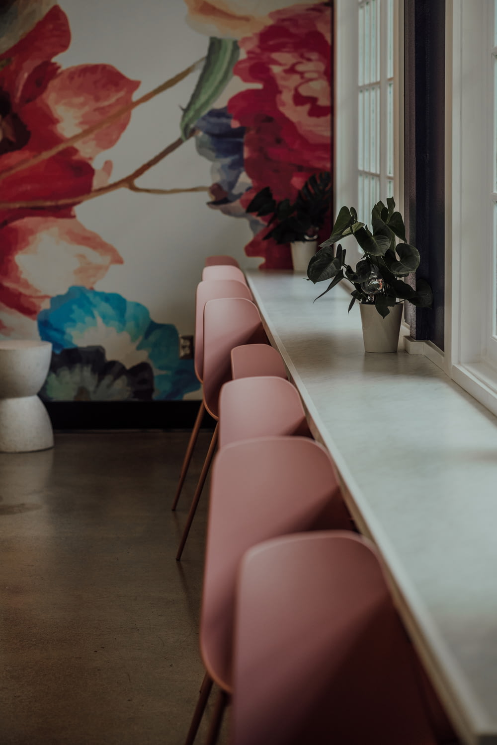 a group of pink chairs in a room