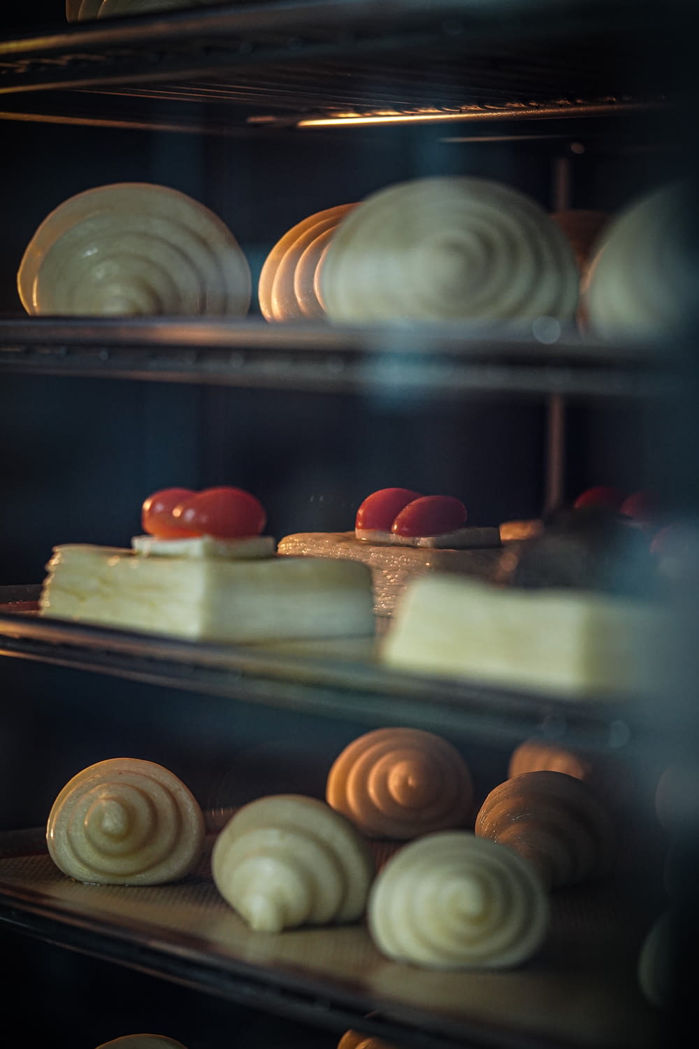 a group of pastries in a fridge