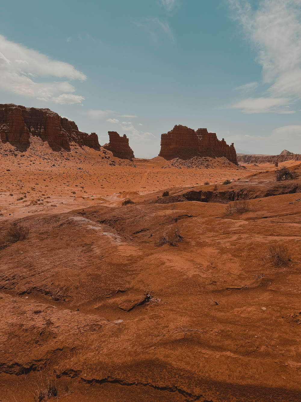 a desert landscape with a few tall rocks