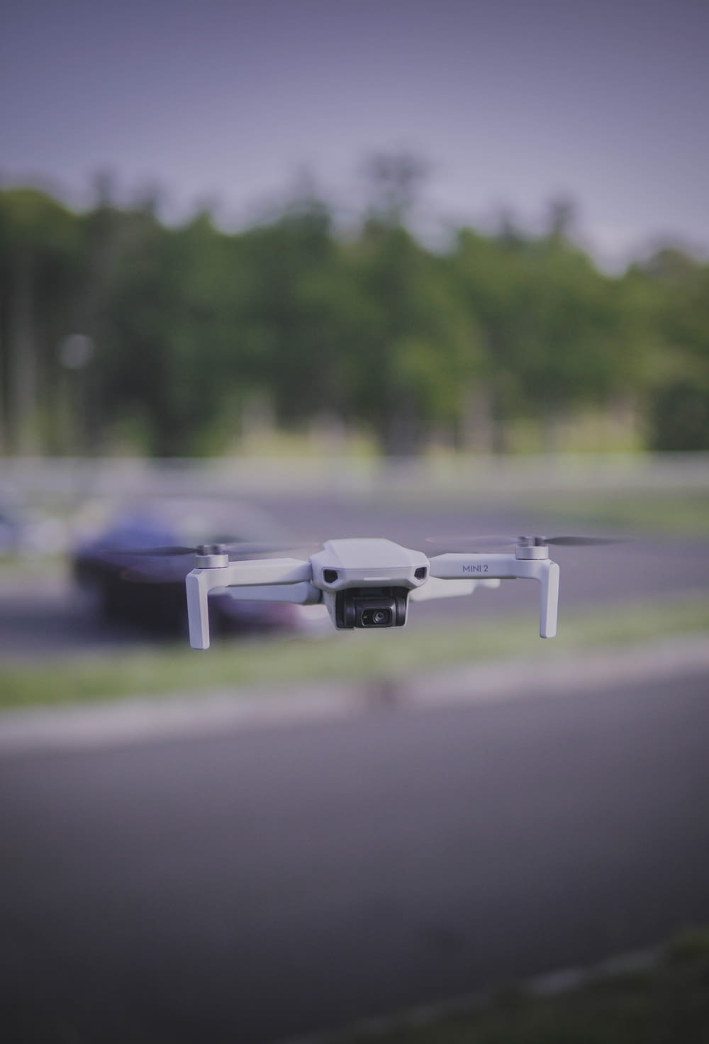 a drone flying over a road
