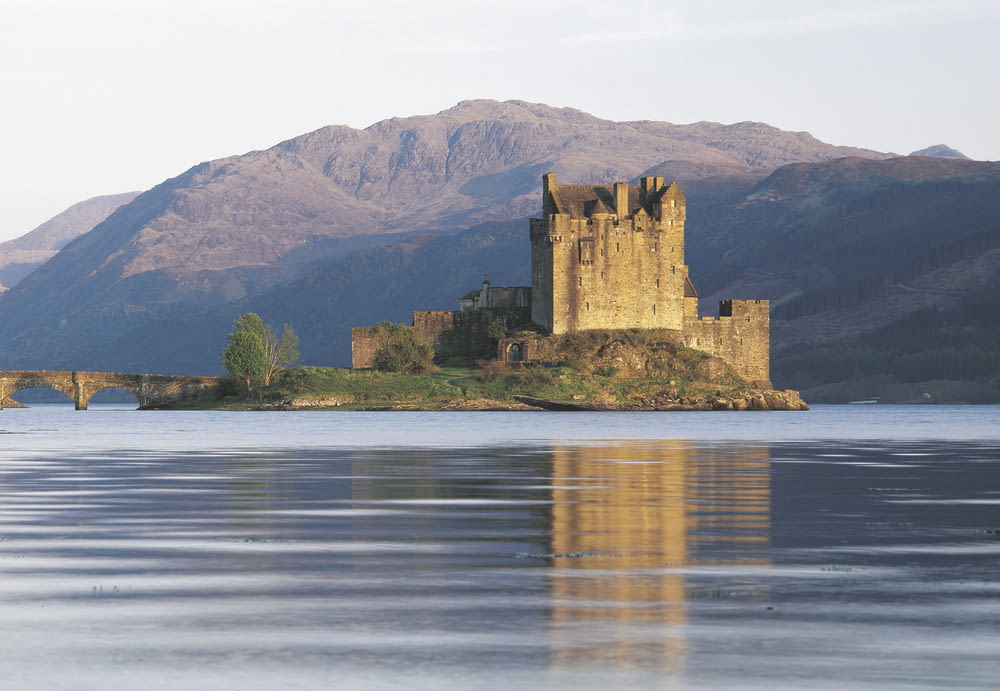 a castle on an island with Eilean Donan in the background