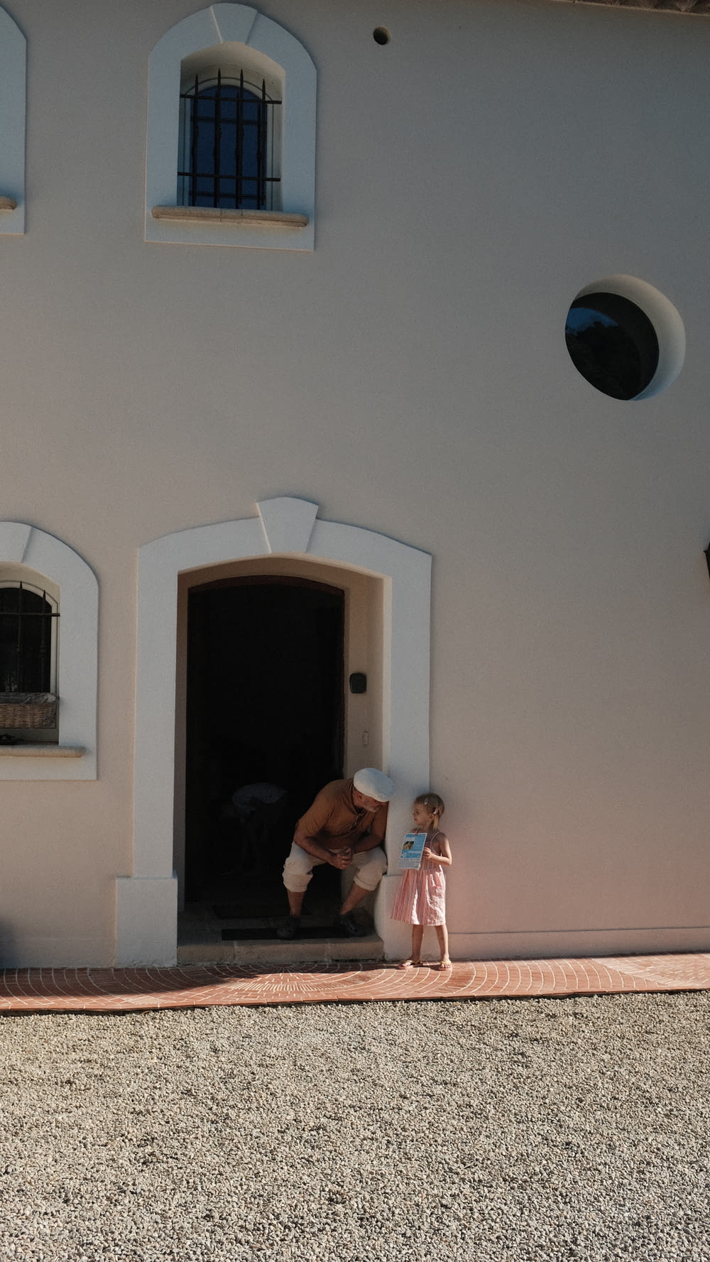 a person and a child standing in a doorway