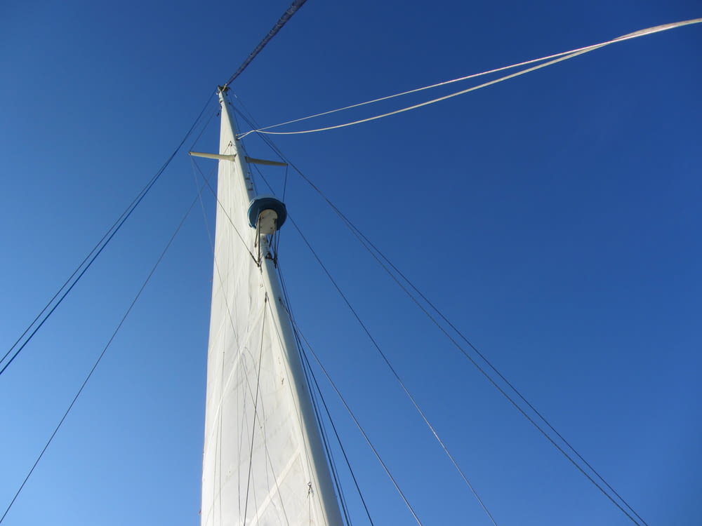 a white sailboat with cables
