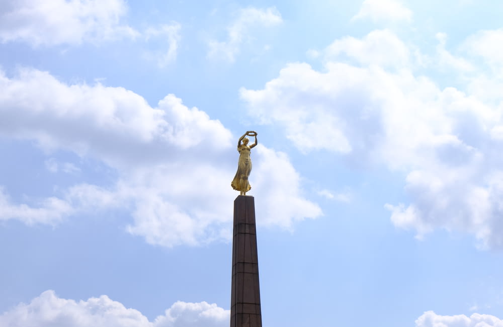 a statue on a pole
