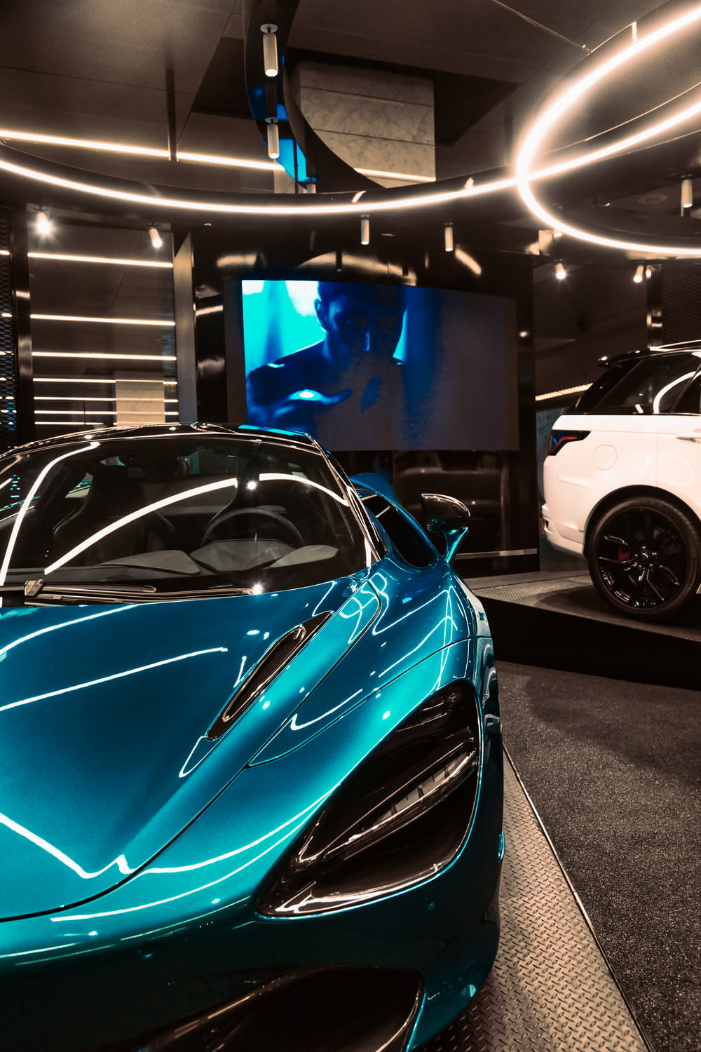 a blue sports car in a showroom