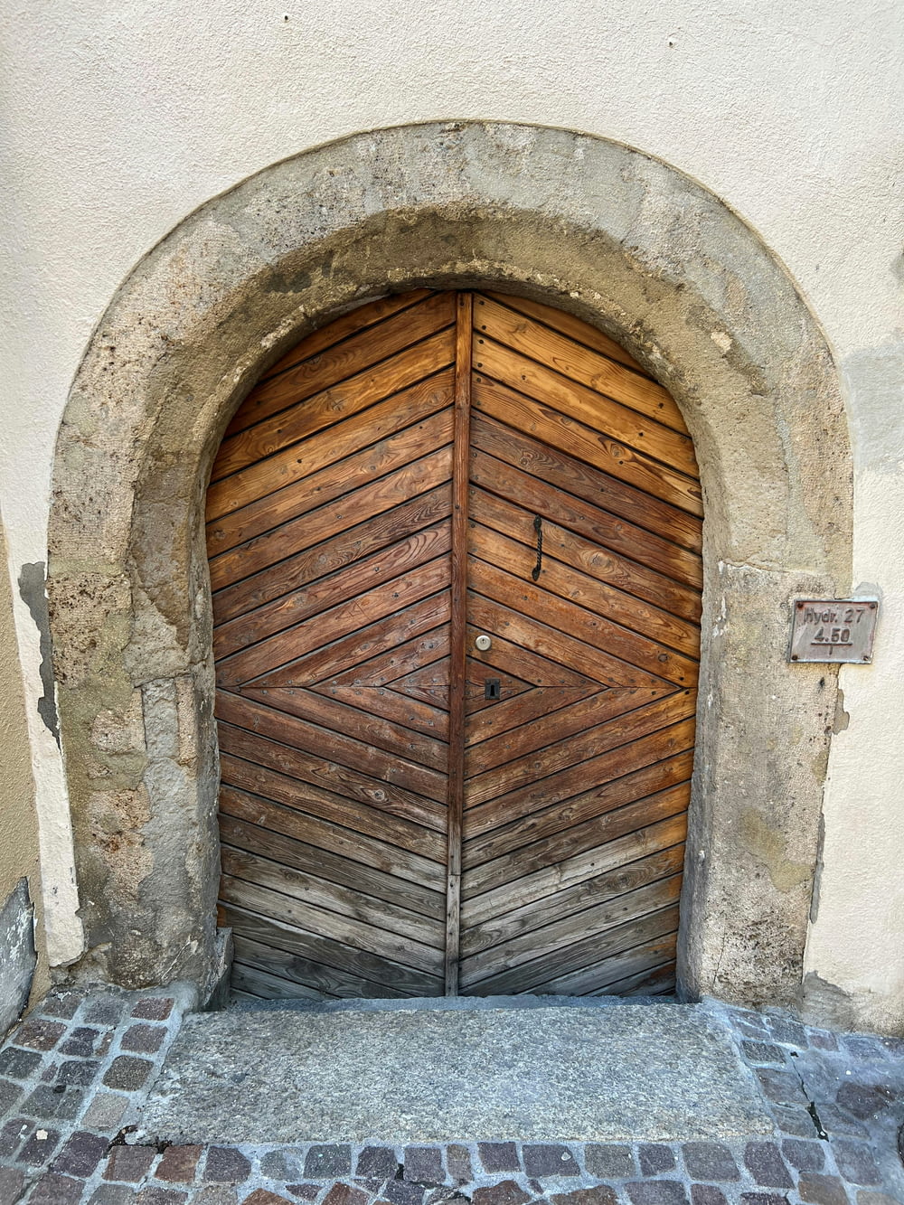 a wooden door in a stone building