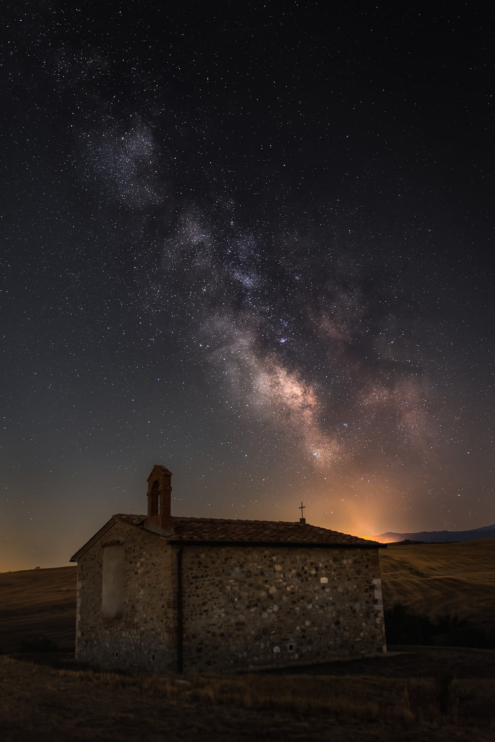 a house with a starry sky above it