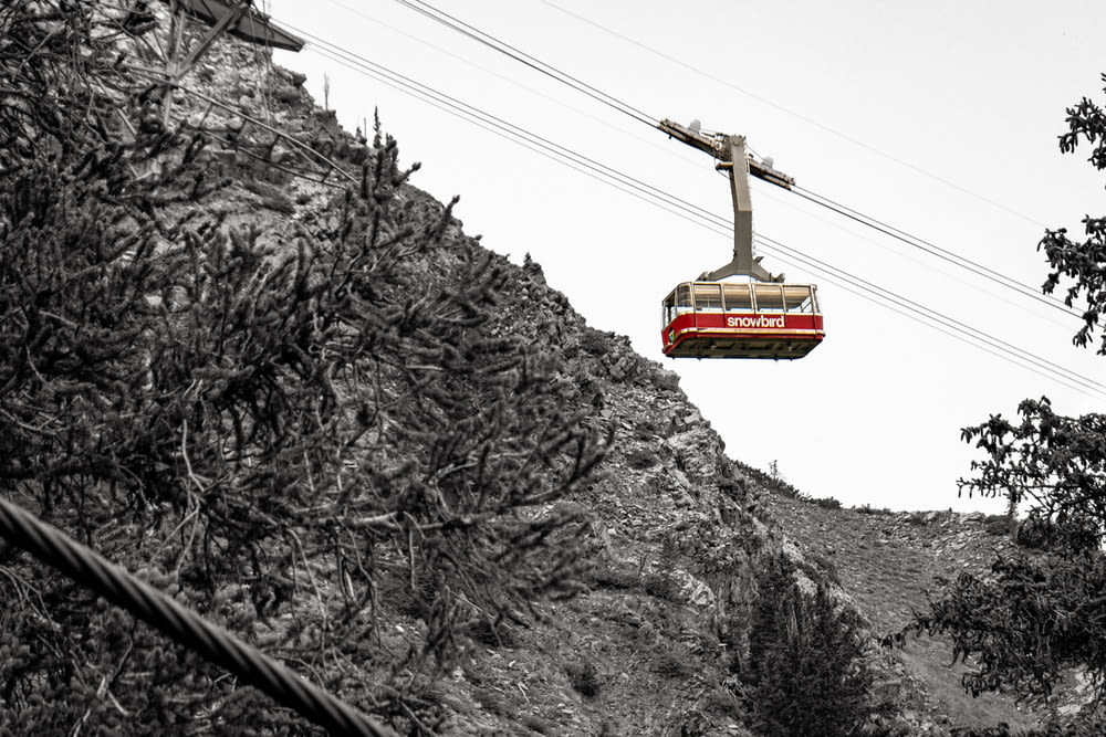 a cable car going over a hill