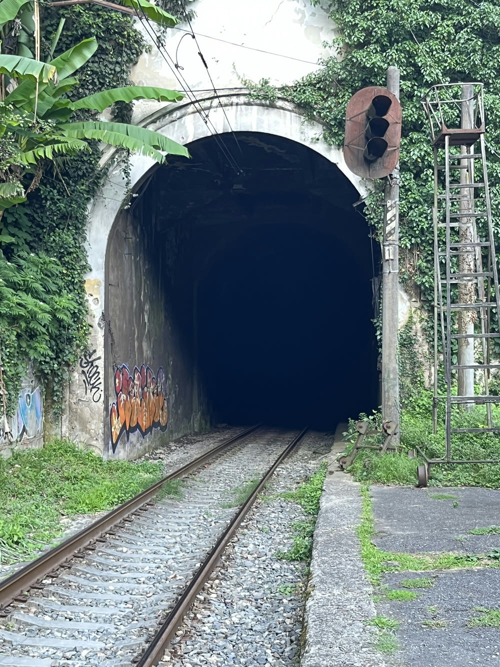 a tunnel with graffiti