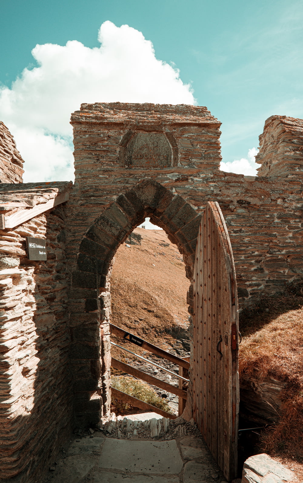 a stone archway with a stone arch