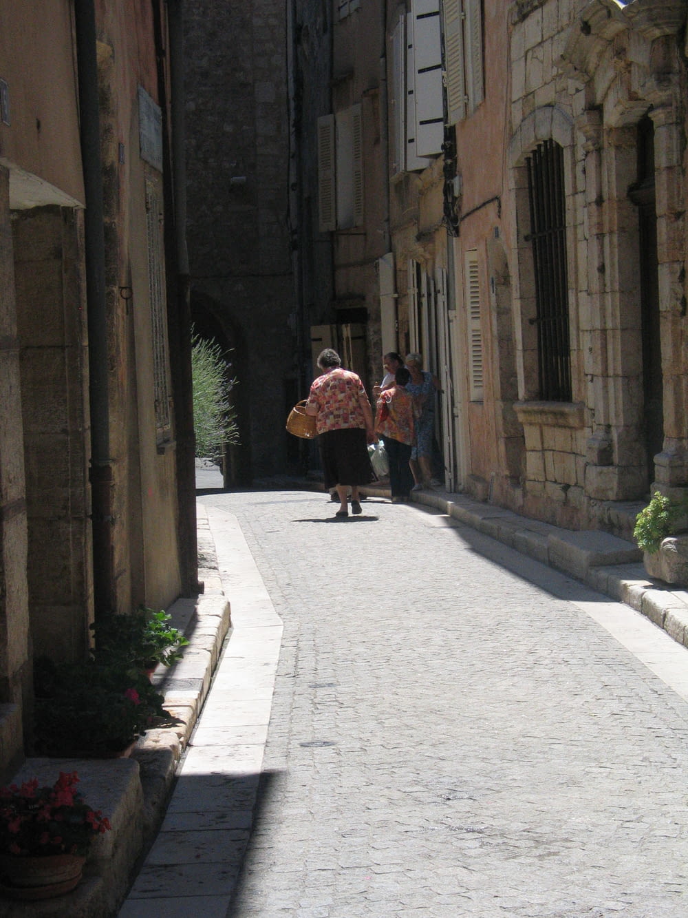 people walking down a street
