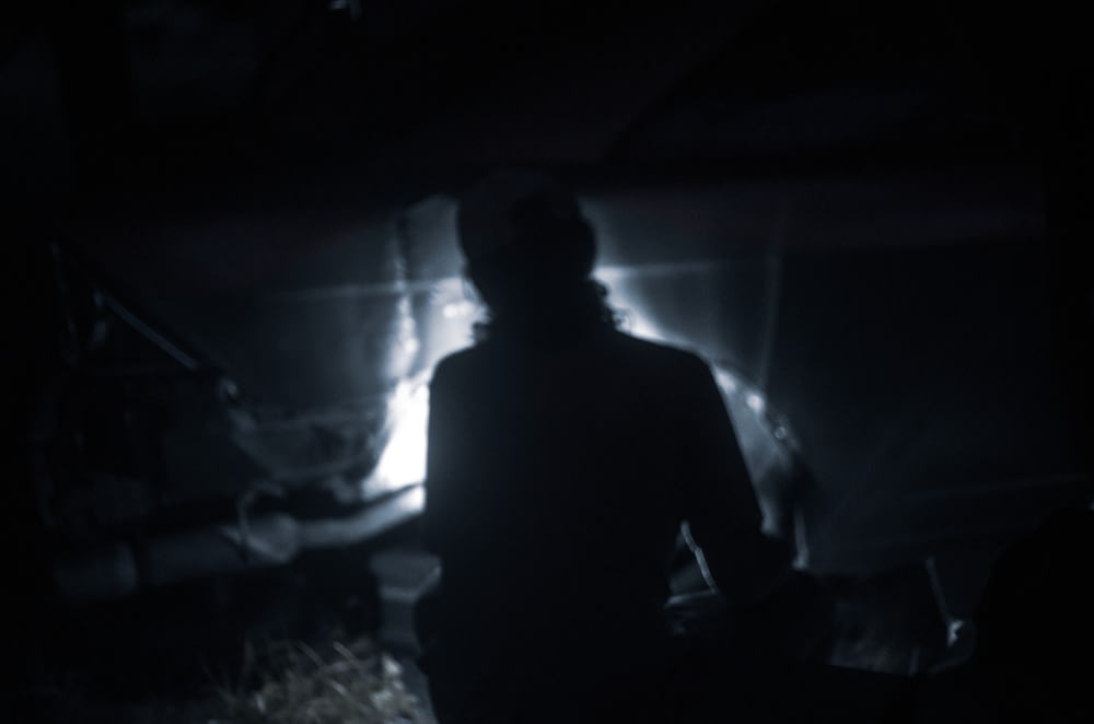a man in a dark room