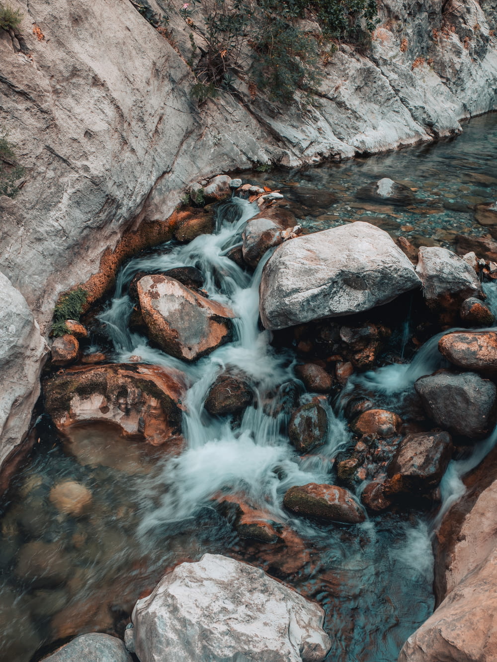 a stream of water flowing over rocks