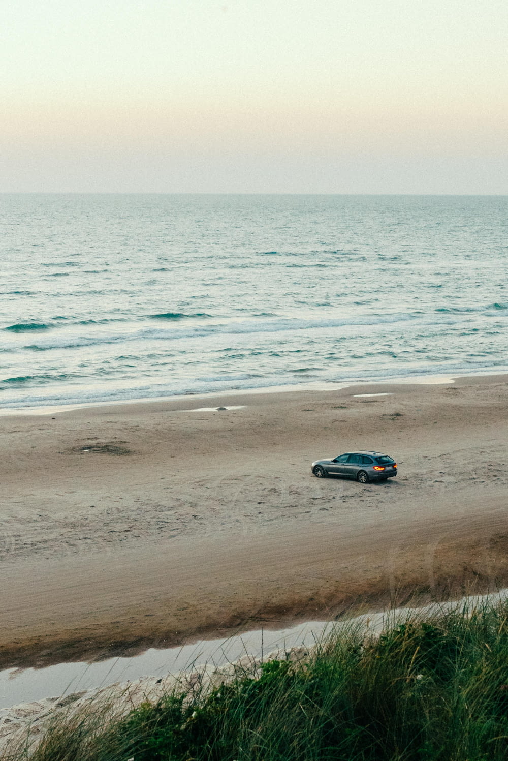 a car driving on a beach