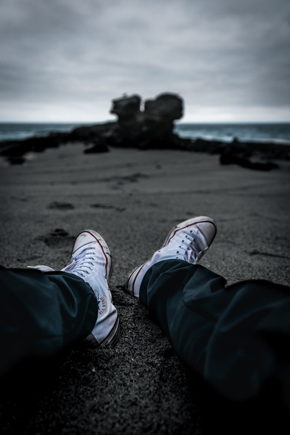 a person's feet on a beach